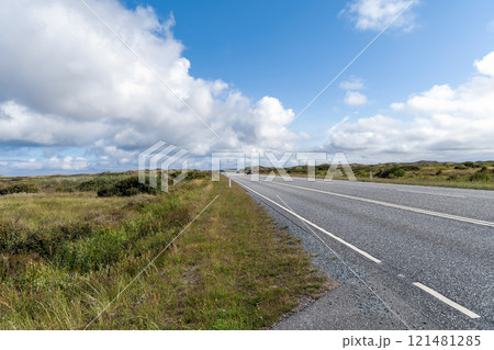 Highway with cars on a cloudy summer day. Highway with cars on a cloudy summer day. 121481285