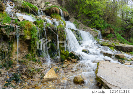 Slovenian keys or streams of the Twelve Apostles, natural and tourist object, Orthodox shrine. Russia, Pskov Region. Izborsk fortress. High quality photo 121481318