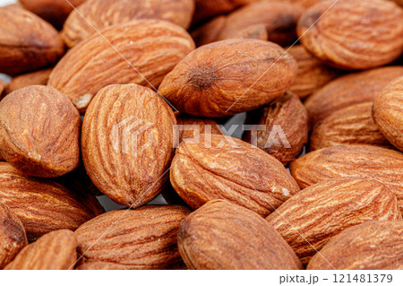 macro almond nuts on a white background 121481379