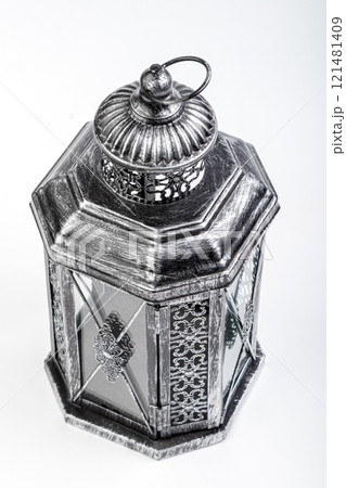 Beautiful vintage metal lantern on a white background Beautiful vintage metal lantern on a white background 121481409