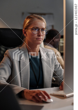 Female programmer clicking mouse 121481987
