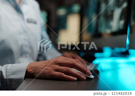 Hand of security guard on computer mouse Hand of security guard on computer mouse 121482019