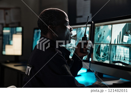 Mature male guard with walkie-talkie Mature male guard with walkie-talkie 121482031