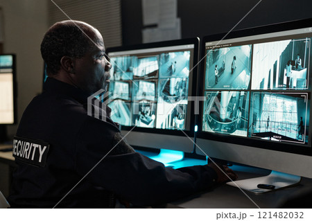 Concentrating on watching cctv video 121482032