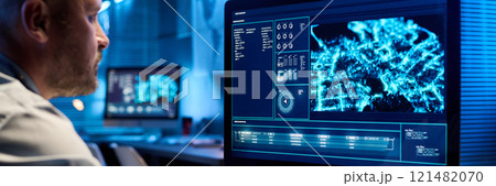 Mature officer in front of screen 121482070