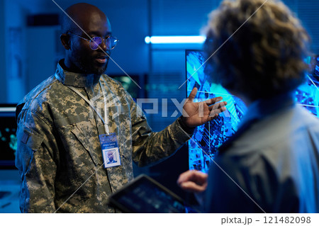 Officer pointing at interactive screen Officer pointing at interactive screen 121482098