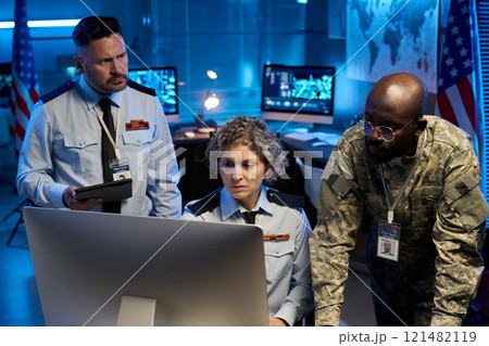 Officers discussing online information Officers discussing online information 121482119