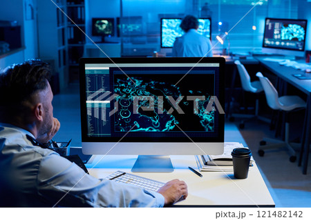 Male officer looking at graphic data 121482142