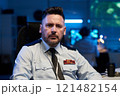 Serious officer in light blue uniform 121482154