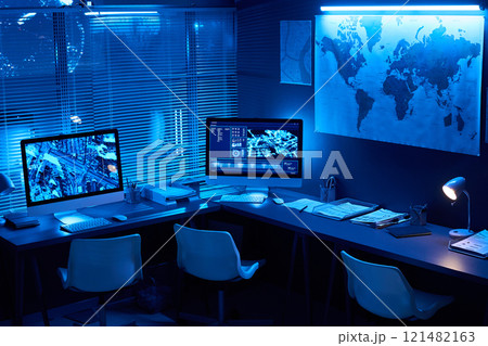 Desks with computer monitors in office 121482163