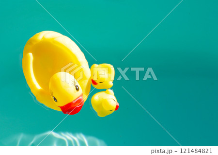 Rubber ducks in blue water 121484821