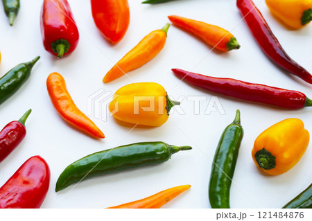 Chili peppers on a white background. 121484876