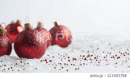 red christmas ball on snow 121485766