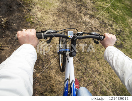 Woman on a bicycle Woman on a bicycle 121489011