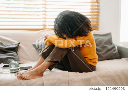 woman sit Depression Dark haired  pensive glance Standing by window and anxiety Copy space. 121490998