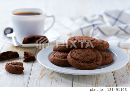 Tasty chocolate cookies and coffee on a white table, selective focus. 121491168