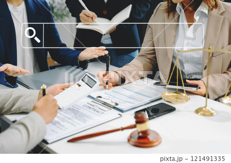 Business team and lawyers discussing contract papers with blank search bar. with digital tablet computer. justice and law concept Business team and lawyers discussing contract papers with blank search bar. with digital tablet computer. justice and law concept 121491335