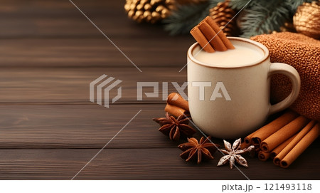 Hot milk in a rustic clay cup, paired with fresh herbs and surrounded by warm tones 121493118