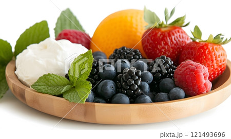 A fresh fruit bowl with a side of quark, styled for a summer brunch 121493696