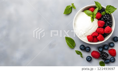 A fresh fruit bowl with a side of quark, styled for a summer brunch 121493697