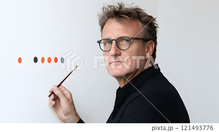 An artist creating a painting that symbolizes acceptance and unity 121493776