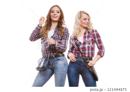 adult daughter and mother with handbags adult daughter and mother with handbags 121494875