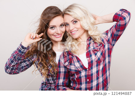 Portrait adult daughter with mother. Portrait adult daughter with mother. 121494887