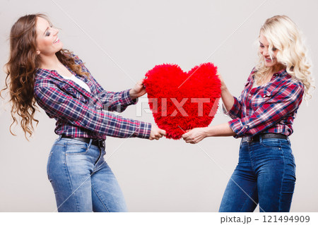 adult daughter and mother with heart love sign adult daughter and mother with heart love sign 121494909