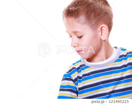 Young boy sit alone thoughtful. 121495223