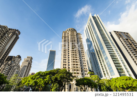 Low angle view of the modern architectural landscape in Taichung, Taiwan. It is near the National Taichung Theater. Low angle view of the modern architectural landscape in Taichung, Taiwan. It is near the National Taichung Theater. 121495531