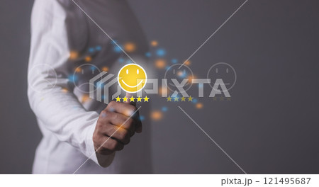 Excellence Review, Young Man hand touching emoji and five star to review and give 5 stars 121495687