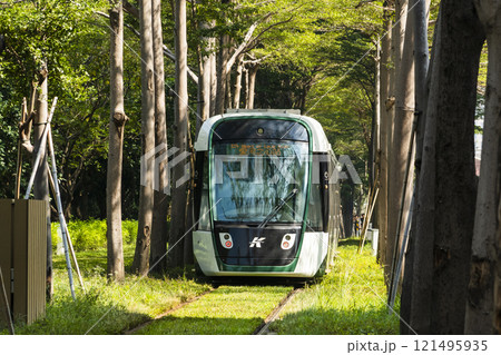 The circular light rail train drives past the Kaohsiung Museum of Fine Arts station in Taiwan. 121495935