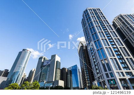 Low-angle view of New Taipei City Government building and other modern buildings in Banqiao, Taiwan. 121496139