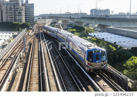 View of a Taoyuan International Airport line train running on the elevated track of the Taoyuan Mass Rapid Transit System. View of a Taoyuan International Airport line train running on the elevated track of the Taoyuan Mass Rapid Transit System. 121496215