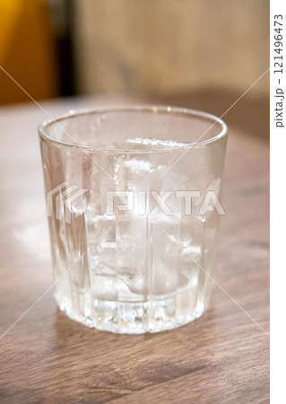 A glass of ice on the table 121496473