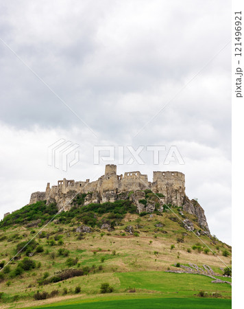 spis castle on the hill in spring. unesco world heritage site. popular travel destination of slovakia. overcast sky. touristic attraction 121496921