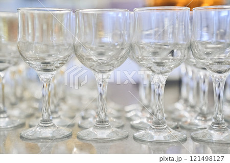 A row of empty, clear, clean wine glasses. Close-up with space to copy. High quality photo 121498127