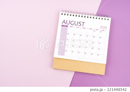 August 2025 desk calendar on pink and purple background. August 2025 desk calendar on pink and purple background. 121498542