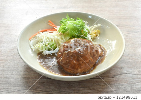 grilled chop pork steak burger dressing gravy sauce with salad on plate grilled chop pork steak burger dressing gravy sauce with salad on plate 121498613