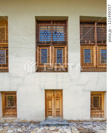 Shakikhanovs Palace showcases intricate wooden architecture in Shaki Azerbaijan during a bright sunny day Shakikhanovs Palace showcases intricate wooden architecture in Shaki Azerbaijan during a bright sunny day 121499357