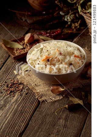 Traditional German sauerkraut on a old rustic wooden table. Traditional German sauerkraut on a old rustic wooden table. 121499883
