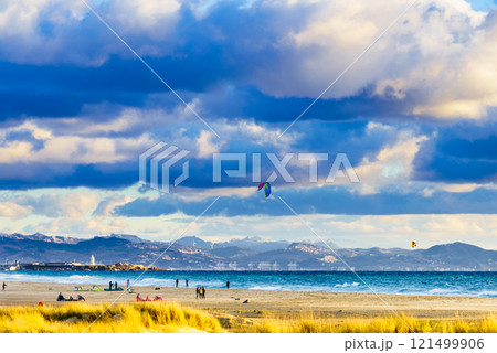 Kite surfers riding waves. Kiteboarding sport. Tarifa Spain. 121499906