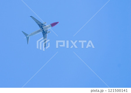 Airplane in the blue sky 121500141