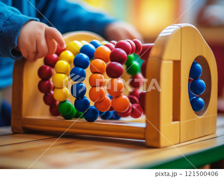 A child practicing Montessori bead threadingのイラスト素材 [121500406] - PIXTA