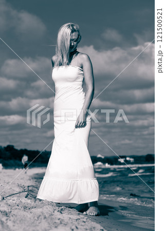 Young lady resting on beach. Young lady resting on beach. 121500521