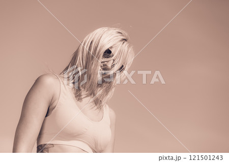 Young girl on beach. 121501243