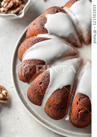 Christmas gingerbread cake glazed on white table close up. Christmas festive dessert, homemade holiday baking recipe Christmas gingerbread cake glazed on white table close up. Christmas festive dessert, homemade holiday baking recipe 121501933