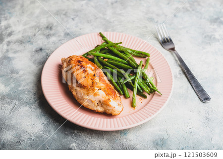 Crispy Chicken Breast Served with Green Beans on Plate Crispy Chicken Breast Served with Green Beans on Plate 121503609