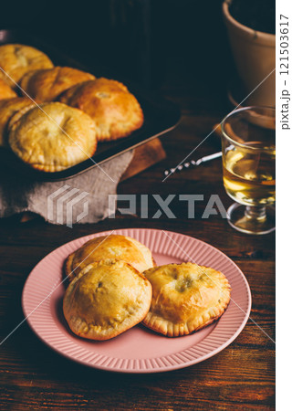 Freshly Baked Pastries with Blue Chives and Mushrooms on Plate Freshly Baked Pastries with Blue Chives and Mushrooms on Plate 121503617