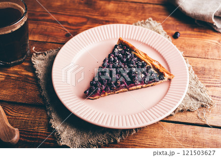 Slice of Amelanchier Berries Galette on Plate 121503627